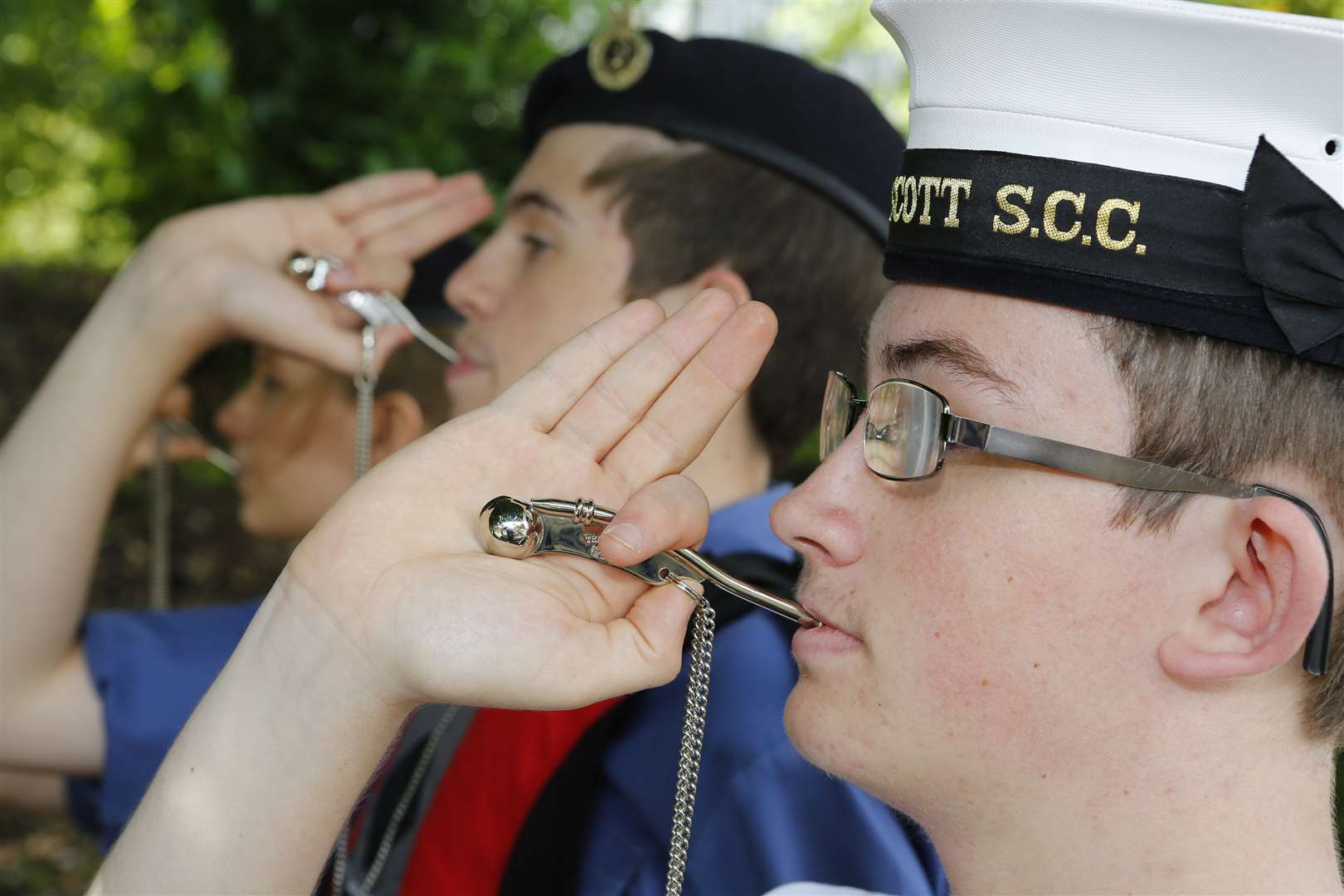 Mayor's cadet Jack Bennett piping cllr Butler on board