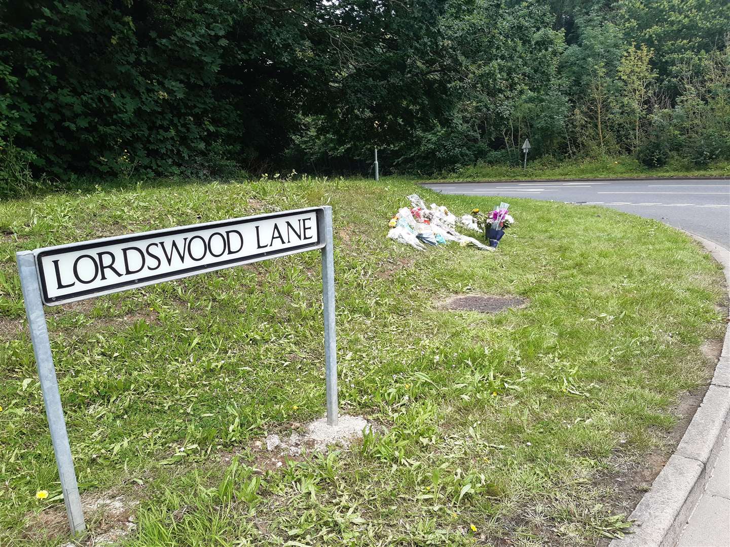 Flowers at the junction of Lordwood Lane and North Dane Way