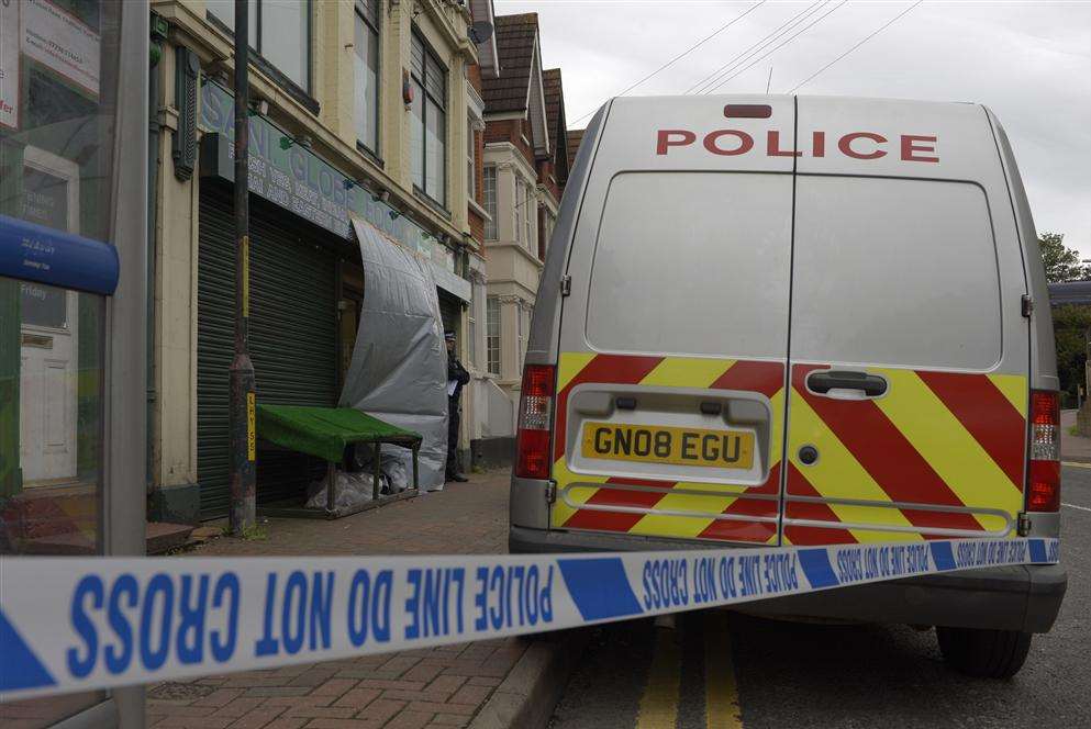 A cordon outside Sani Globe food store in Luton Road