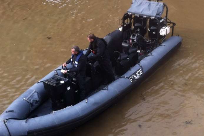 A police boat goes to assist the stranded man. Picture: Phil Murfin