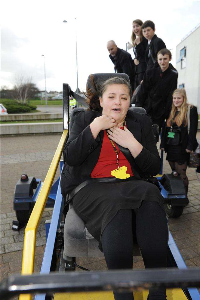 Alesha Reynolds, 15, braces herself on the seat belt sledge as part of a Road Safety Awareness Day at Marlowe Academy. Picture: Tony Flashman