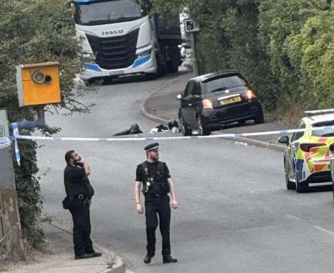 Police taped off London Road in Swanscombe on Wednesday, August 13, after two men were injured and taken to hospital. Picture: Roamescu Cosmin