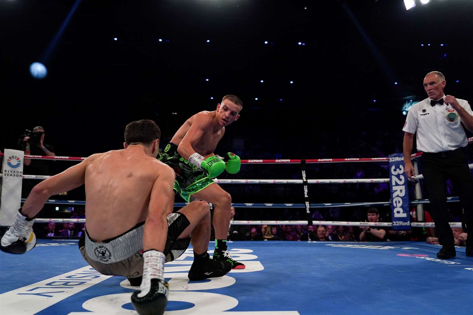 Maidstone boxer Dennis McCann floors Brad Strand in the second round of their title fight. Picture: Stephen Dunkley / Queensberry Promotions