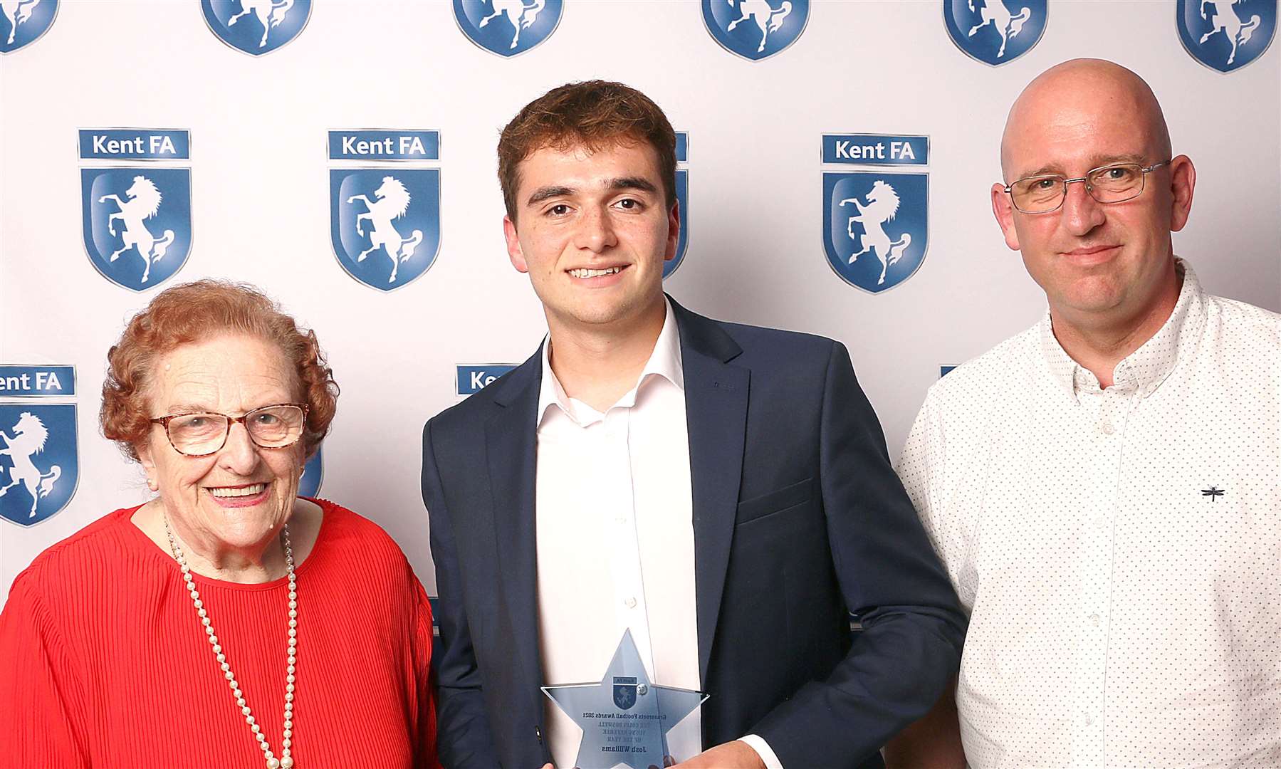 Josh Williams picks up the Colin Boswell refereeing trophy at the Kent FA awards