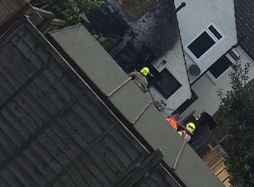 Firefighters inspect the damage.Picture: Una Seale