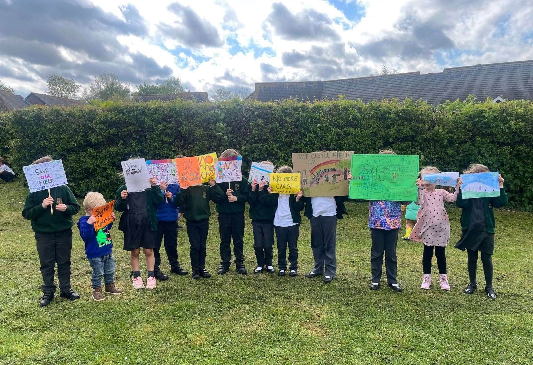 The children with the banners they made