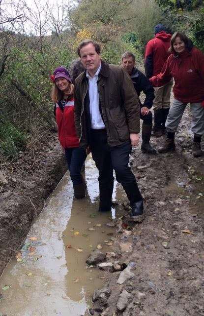 MP Charlie Elphicke looks at the damage done to the right of way near Guston with members of the White Cliffs Ramblers