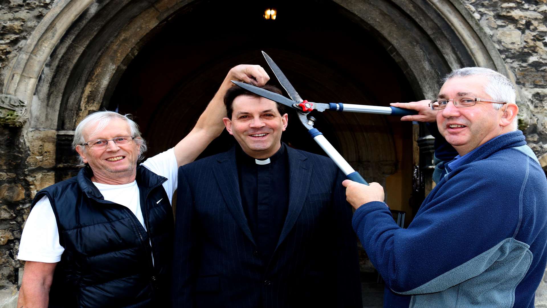 Parishioners Ken Dixon and Alan Gregory with Revd Martin Henwood. Picture: Tony Stigle