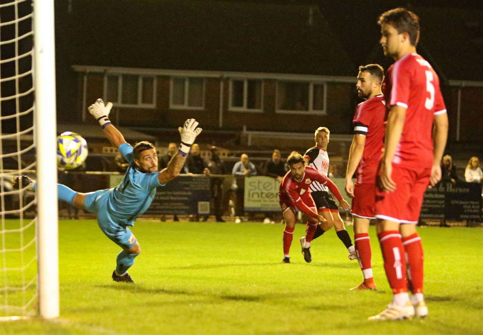 Deal's Tom Chapman arrows a shot past Whitstable player-goalkeeping coach Dan Eason in their midweek 3-0 win. Picture: Paul Willmott