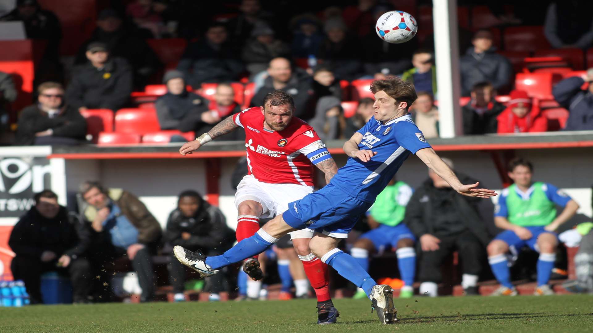 Ebbsfleet captain Danny Kedwell plays the ball under pressure from Tom Bradbrook Picture: John Westhrop