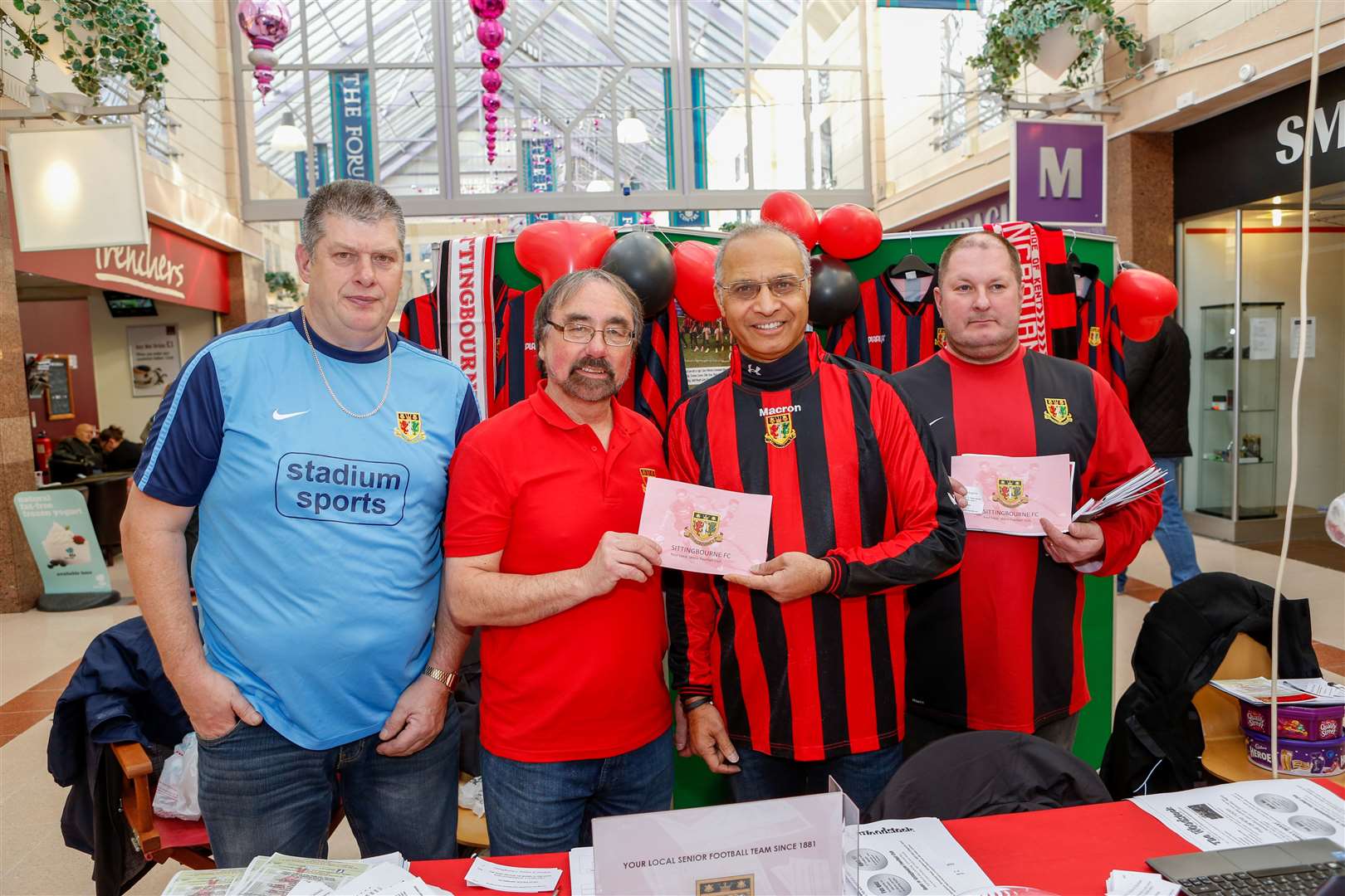 Peter Pitts, second left, representing Sittingbourne FC in an event at The Forum Shopping Centre in 2015. Picture: Matthew Walker