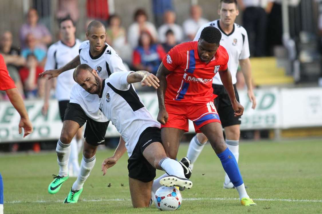 Antonio German battles for possession against Dartford Picture: John Westhrop