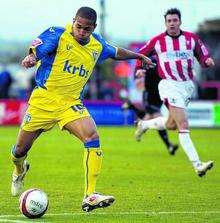 Simeon Jackson gets a shot in on the Exeter goal