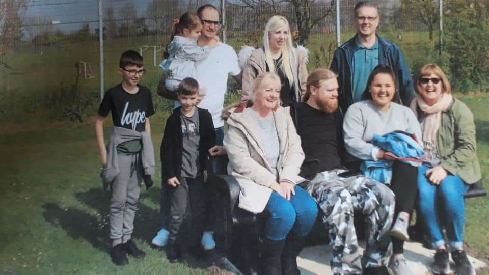 Family and friends gather at the unveiling of a memorial bench for Victor Clarke, who was known as Vic