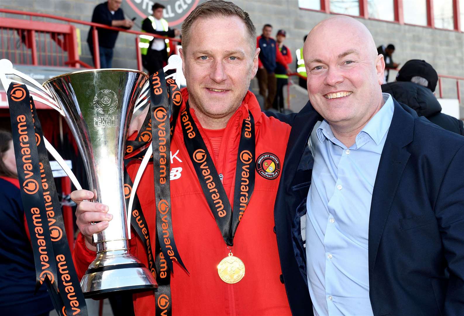 Ebbsfleet boss Dennis Kutrieb celebrates his side's 2022/23 National League South title win with chief executive Damian Irvine. PIcture: Simon Hildrew