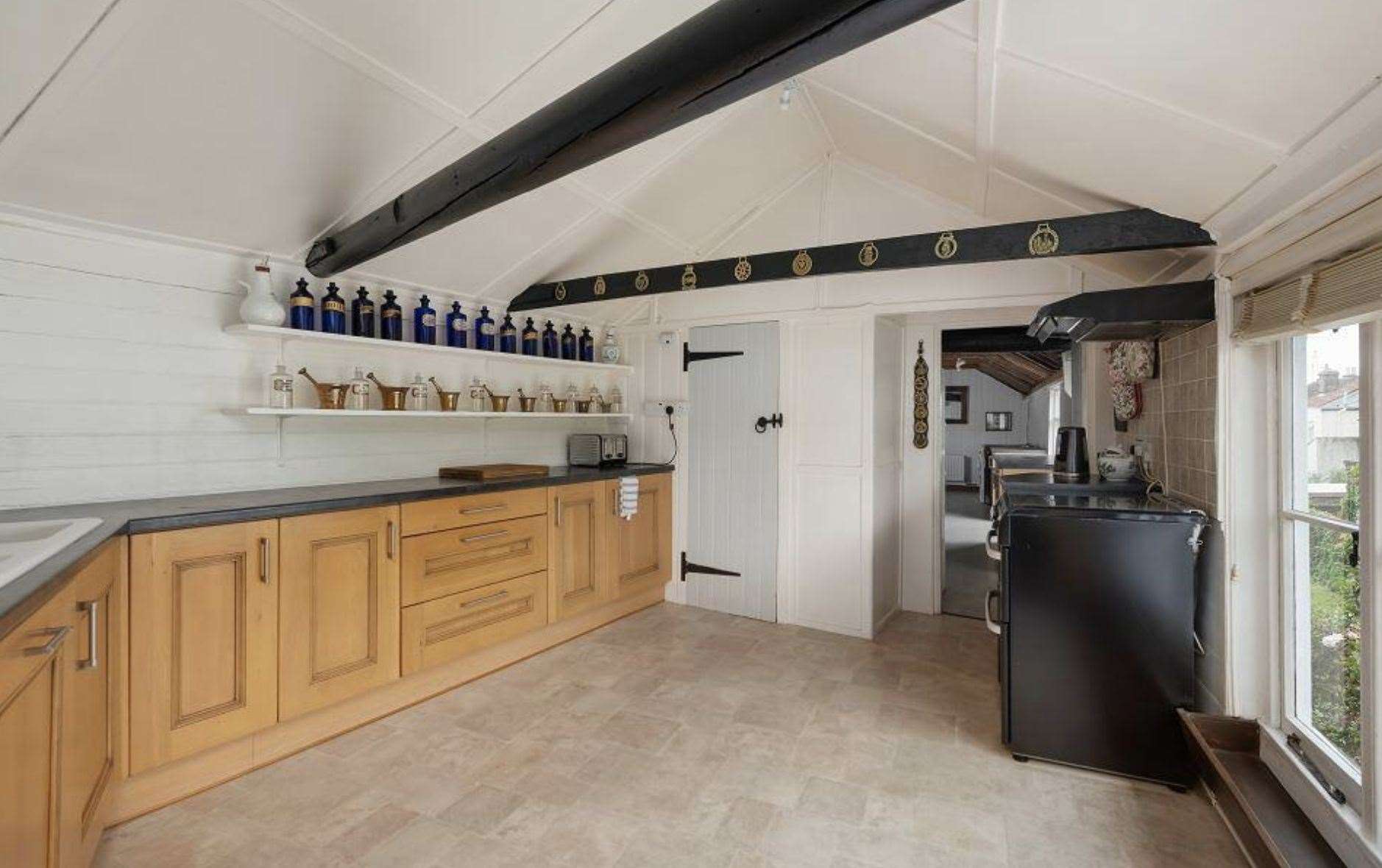 The kitchen of the vacant residential property also included in the sale