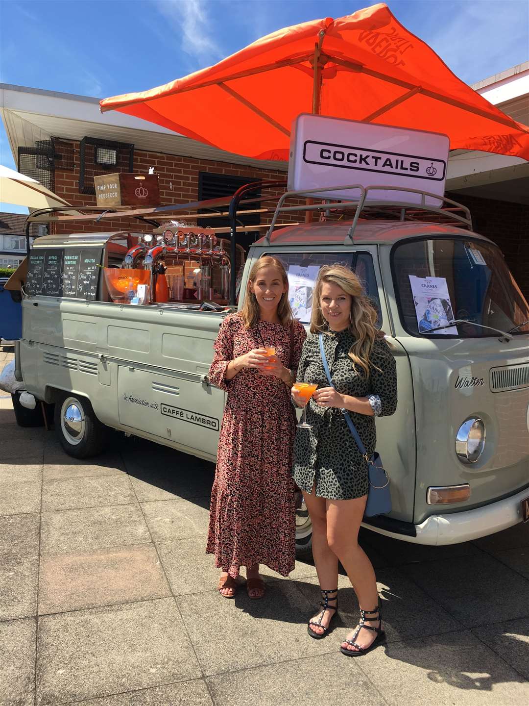 Passers by enjoy a take away drink from the prosecco bar which popped up at Walmer Paddling Pool during lockdown. Picture: Caffe Lambro