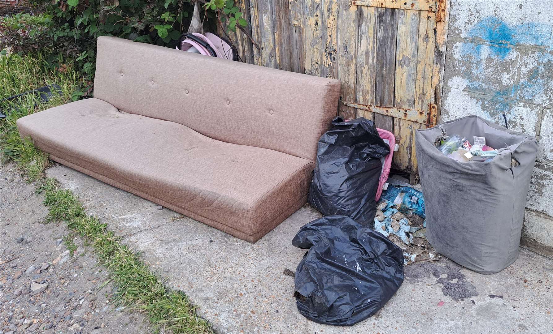 Rubbish left in one of the alleyways behind Folkestone Road