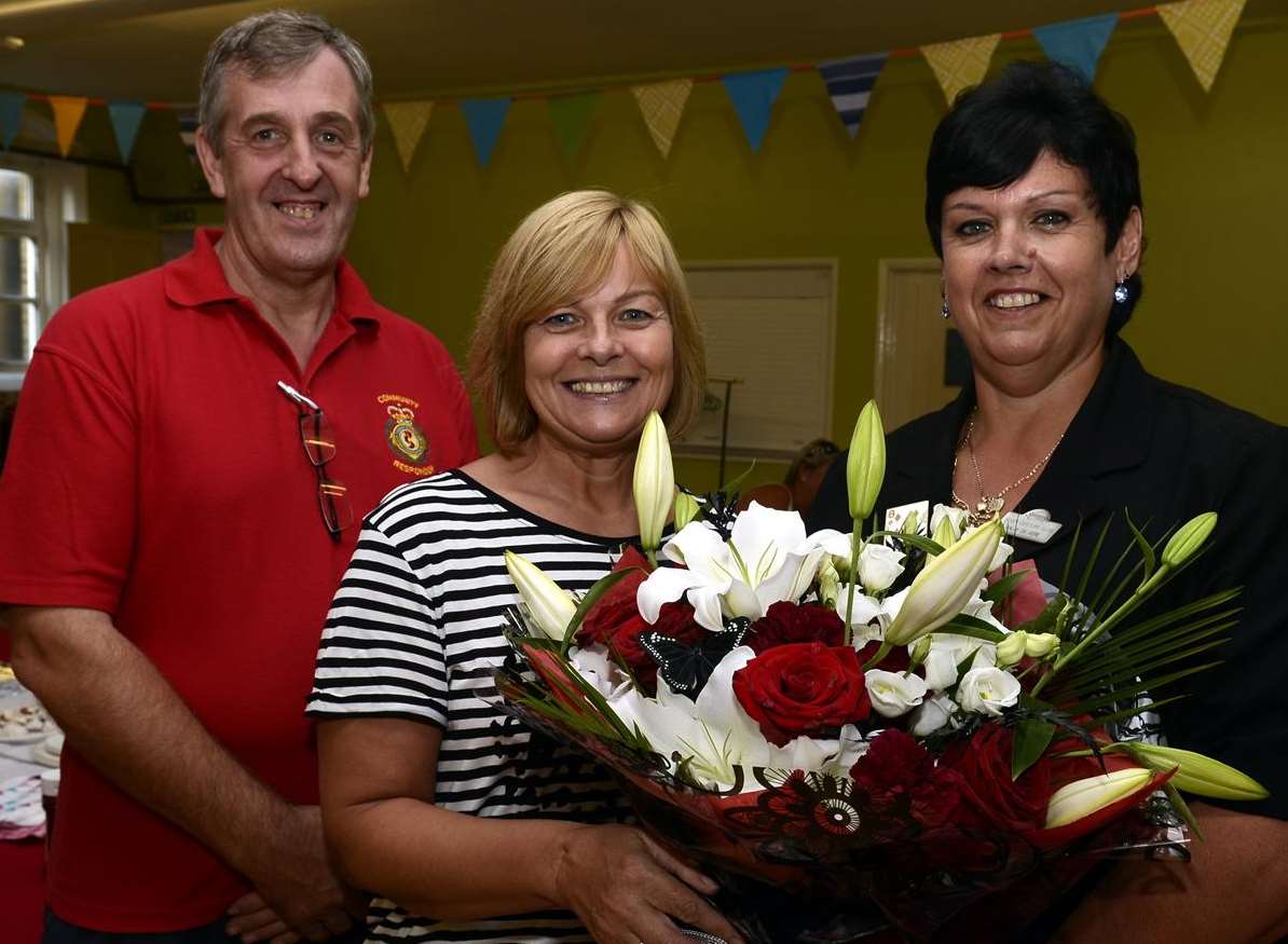 Community First Responder Doug Baseden, Community First Responder Carol Lewis and Sally de Vere at the presentation to Carol