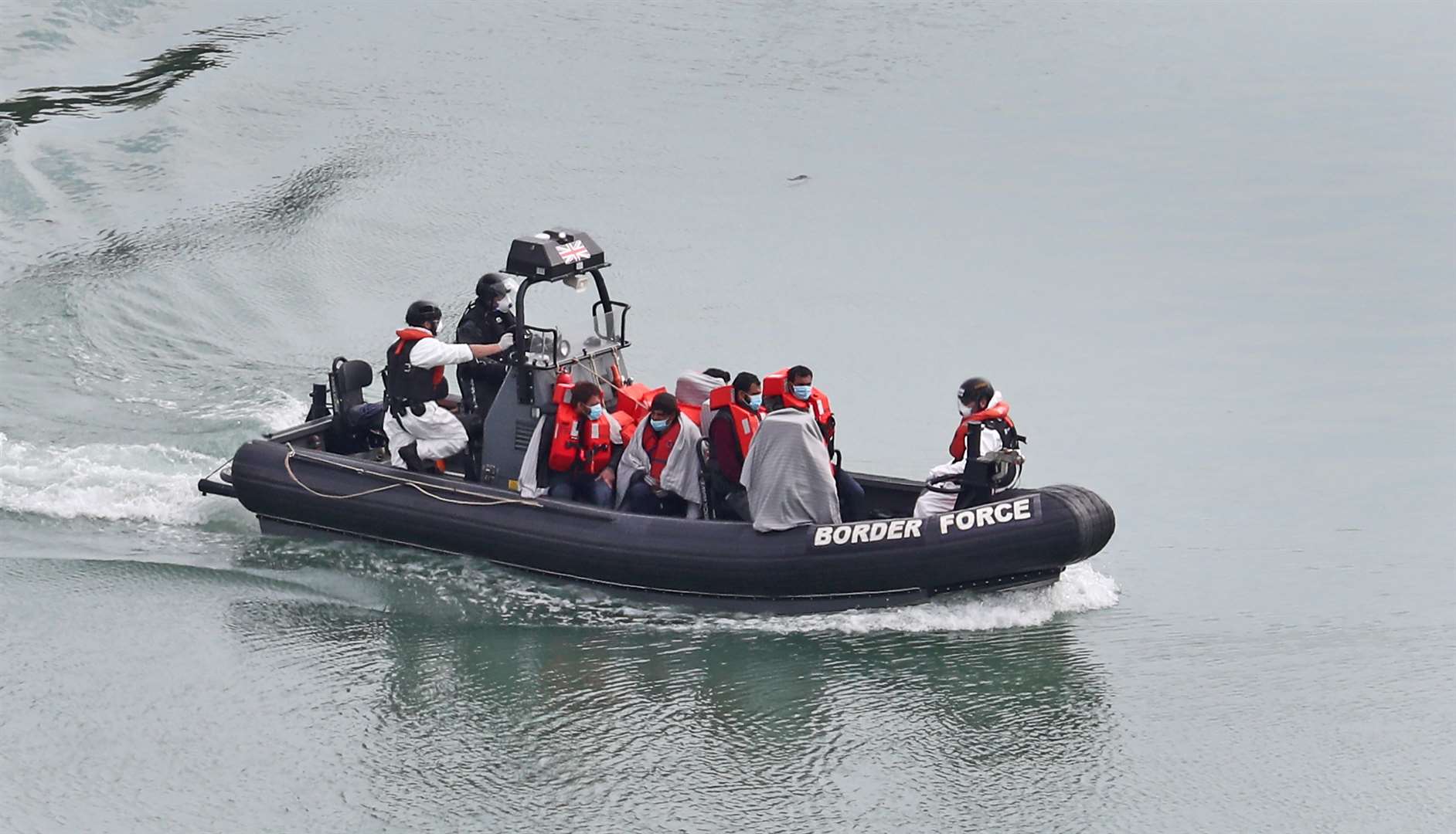 A Border Force vessel carries a group of people thought to be migrants (Gareth Fuller/PA)