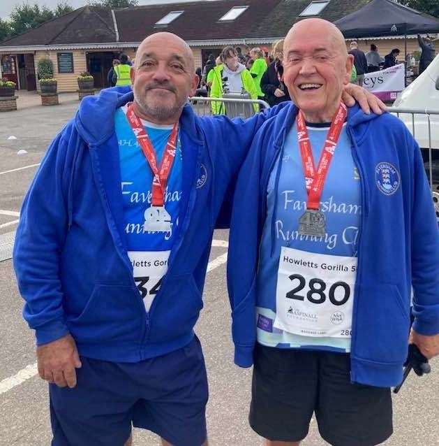 Ray Johnson, right, with friend Graham Bedford and their medals at the Howletts 5km run