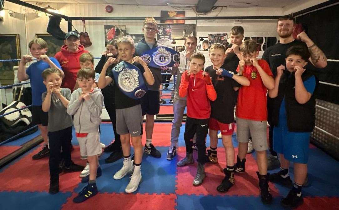 Belt winners Ronny Heaver and Keaton Young with their stable-mates at Leo's Lions ABC base in Crete Hall Road, Northfleet, Gravesend