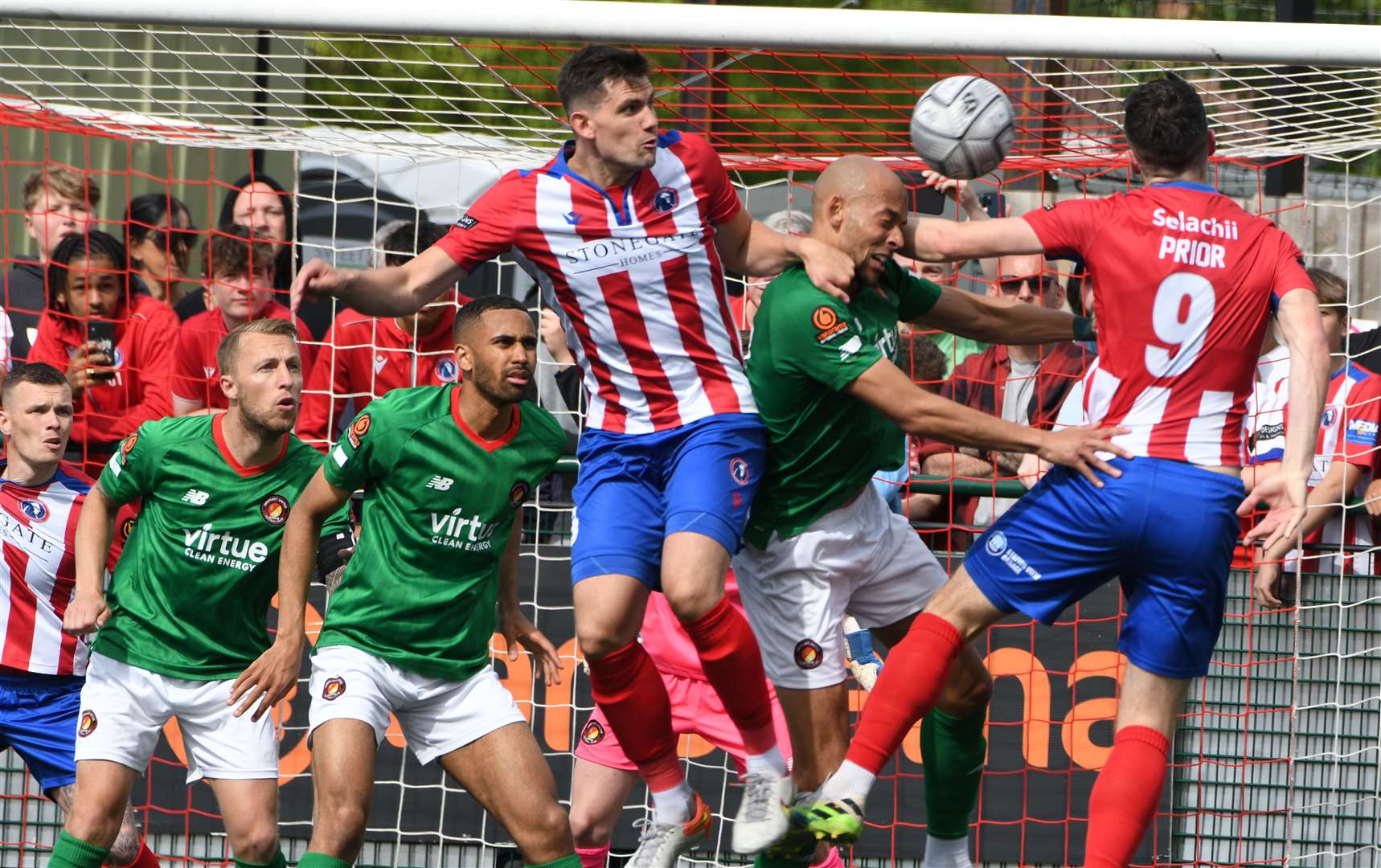 Fleet's Alex Finney competes in the air against Dorking. Picture: Barry Goodwin