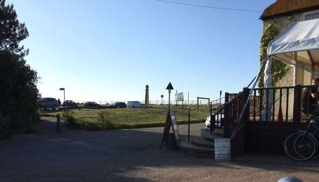 The view from the other side of the track – just over the green and beyond the car park, the walkway runs right along the seafront