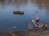 The dad filmed the children on the lake