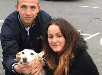 Lady the lurcher, reunited with her owners Oliver Bennett and Lucy Eke