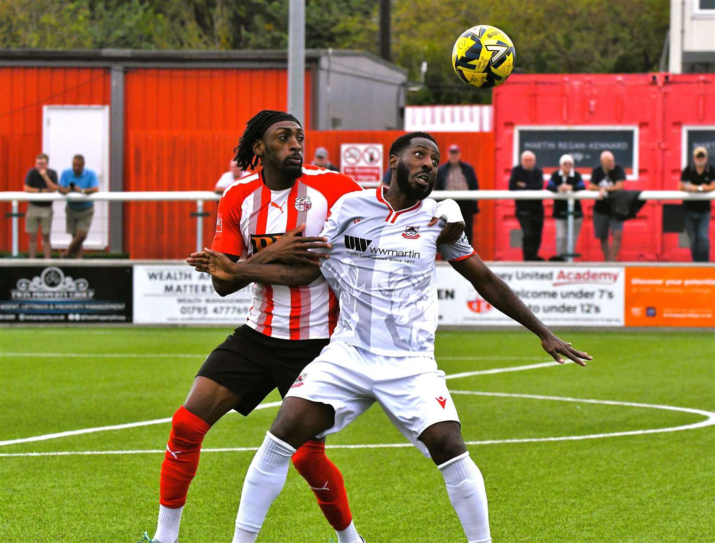 Roarie Deacon, right, battles with Sheppey winger Gil Carvalho. Picture: Marc Richards