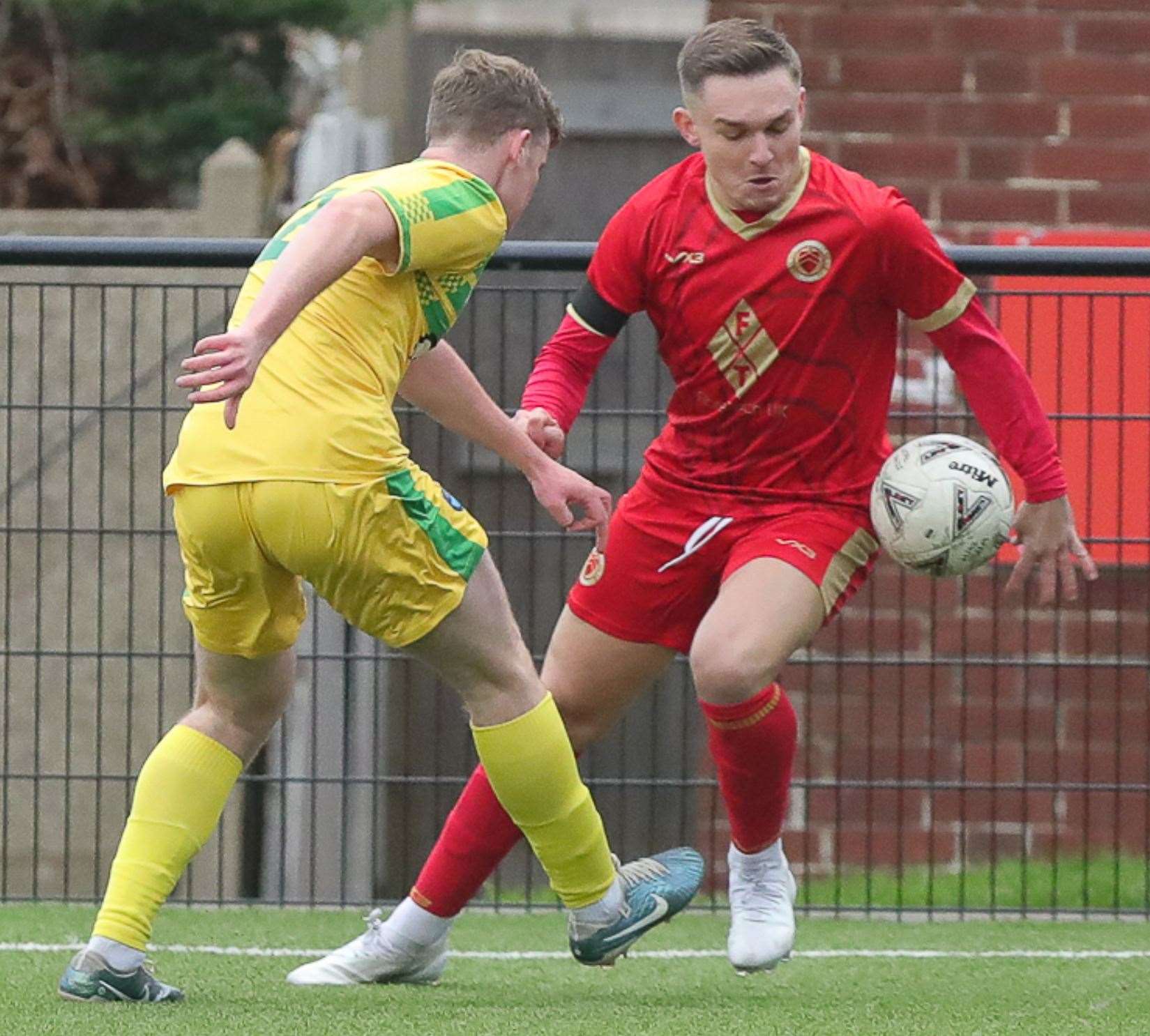 Whitstable’s Josh Oliver up against Lydd's Elliott Moore in Saturday’s FA Vase second round-tie, which the Oystermen edged 2-1. Picture: Les Biggs