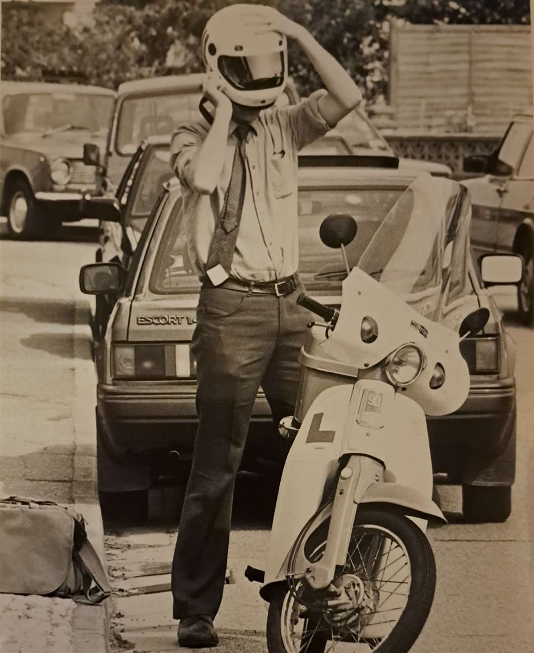 Ready to go. Reporter Sam Lennon about to set off on his motorcycle, August 1990. Picture: Colin Mearns