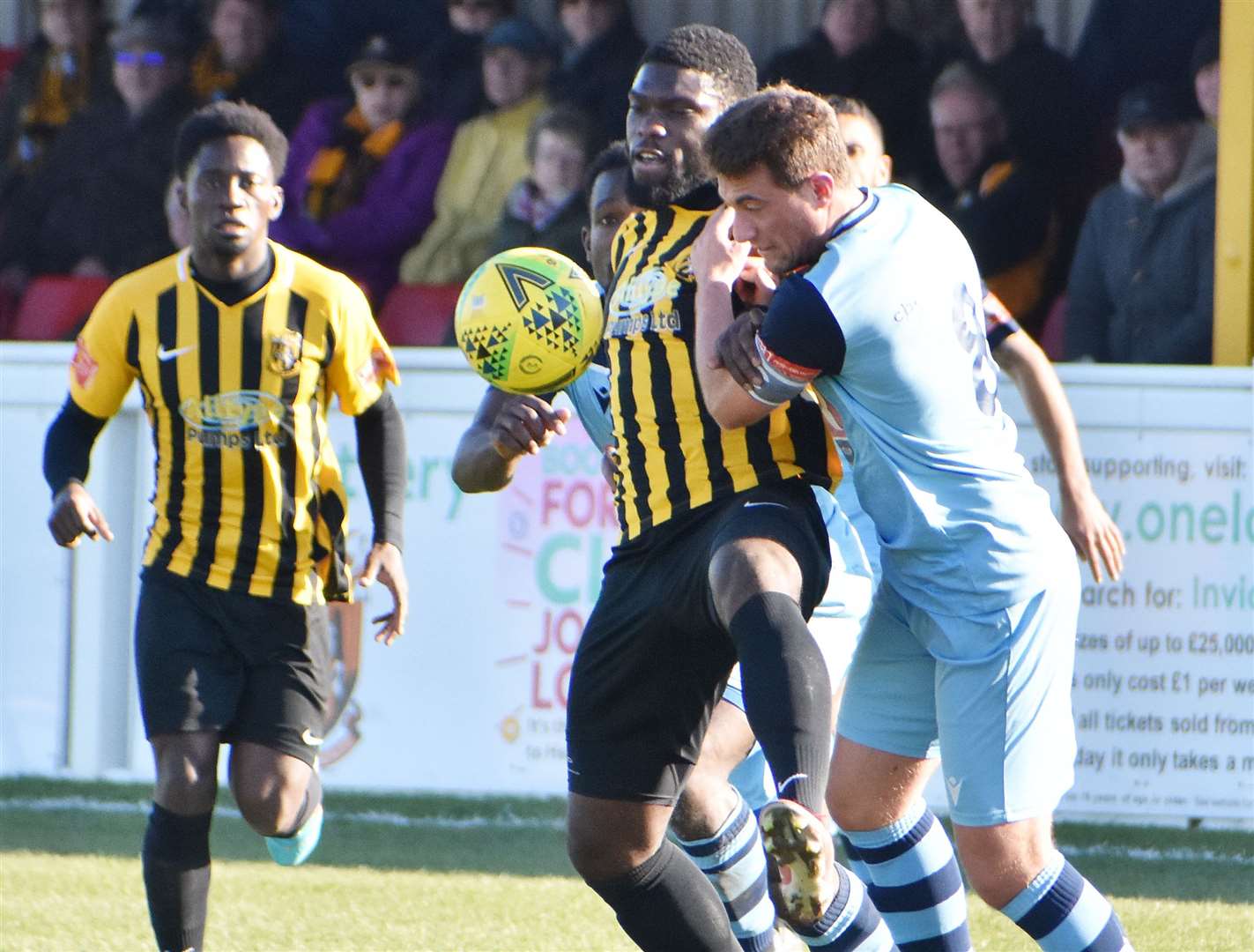 Dave Smith battles a Cheshunt player for the ball as Luke Wanadio watches on. Picture: Randolph File