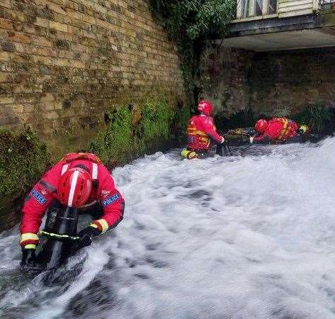 The police marine unit search the River Dour near Dover following Derek O’Hare’s death