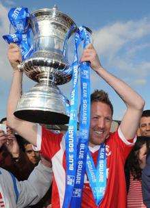 Jamie Day with the Blue Square Bet South trophy