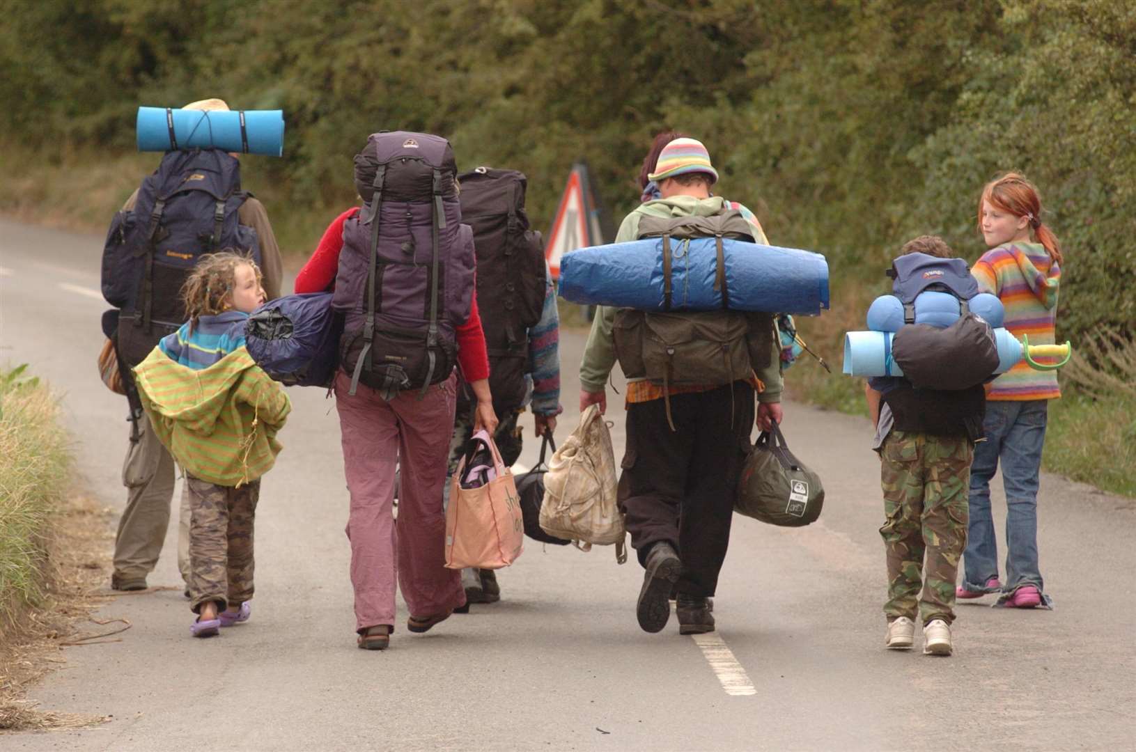 People leaving the camp