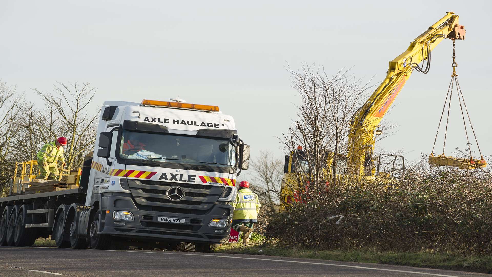 Machinery involved in repairs on the burst main is lifted into place