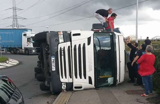 The driver is helped out of the cab