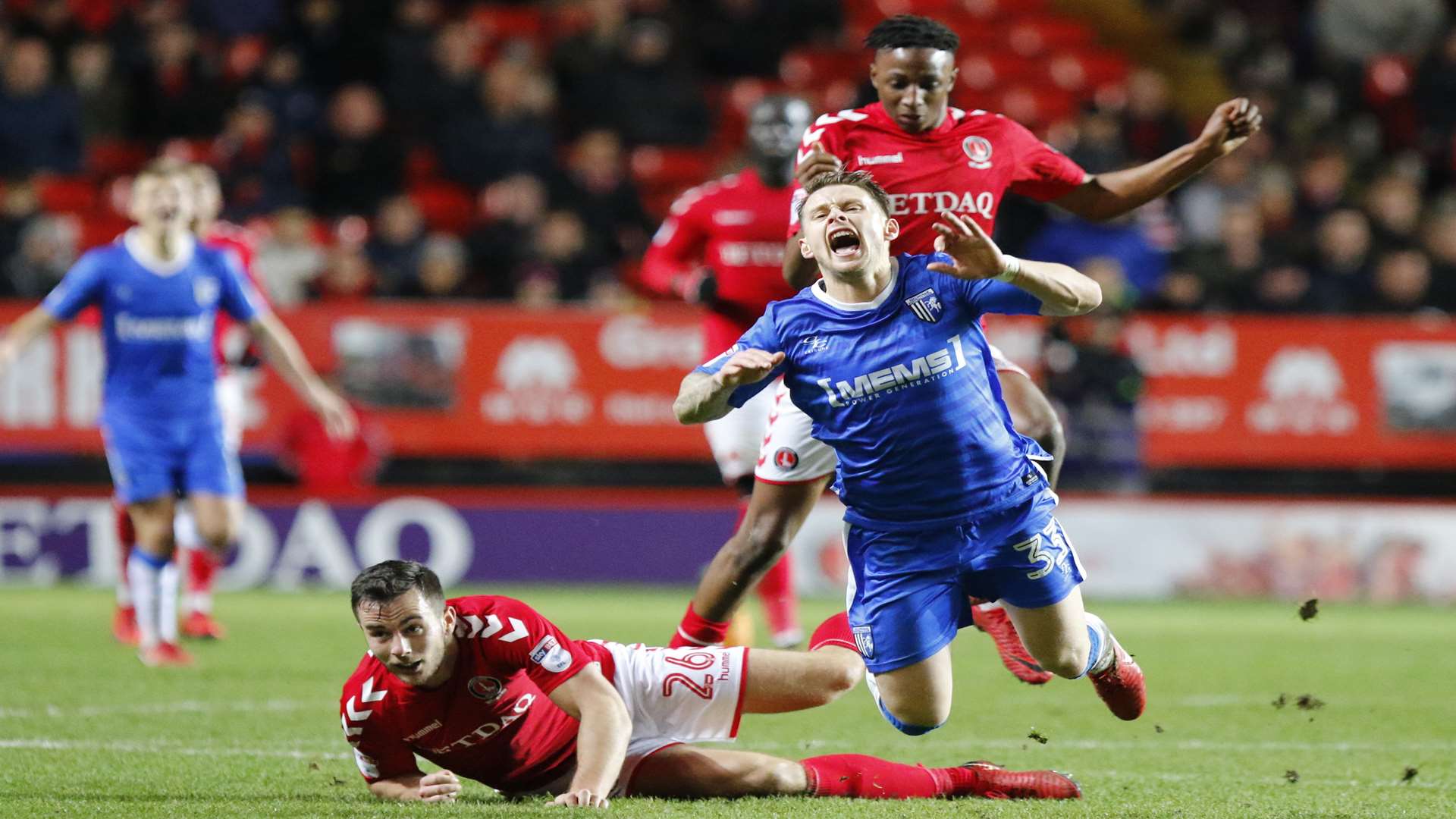 Mark Byrne takes a tumble as Harry Lennon challenges Picture: Andy Jones