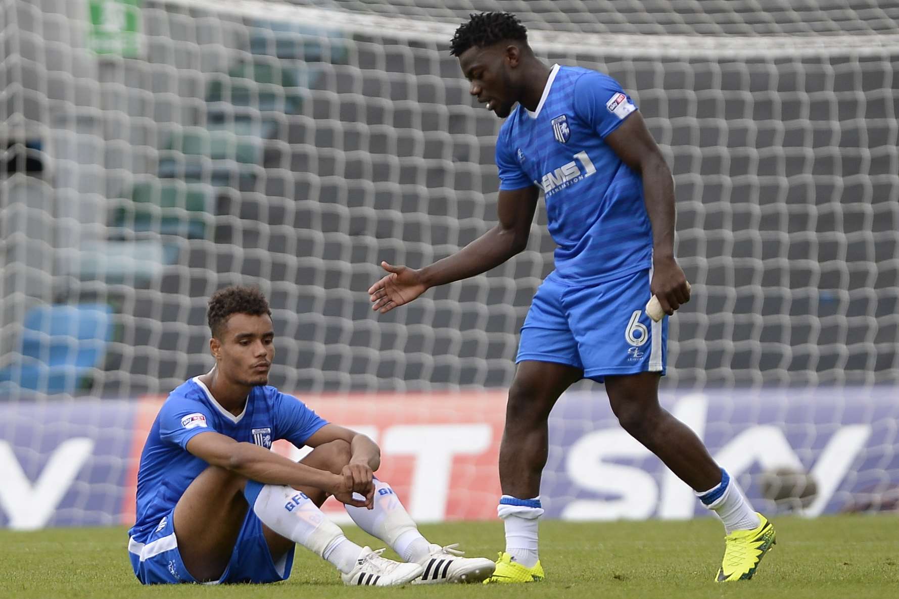 Josh Pask consoled by Deji Oshilaja after conceding an injury-time penalty, a decision referee Darren Handley didn't have hard to think about Picture: Ady Kerry