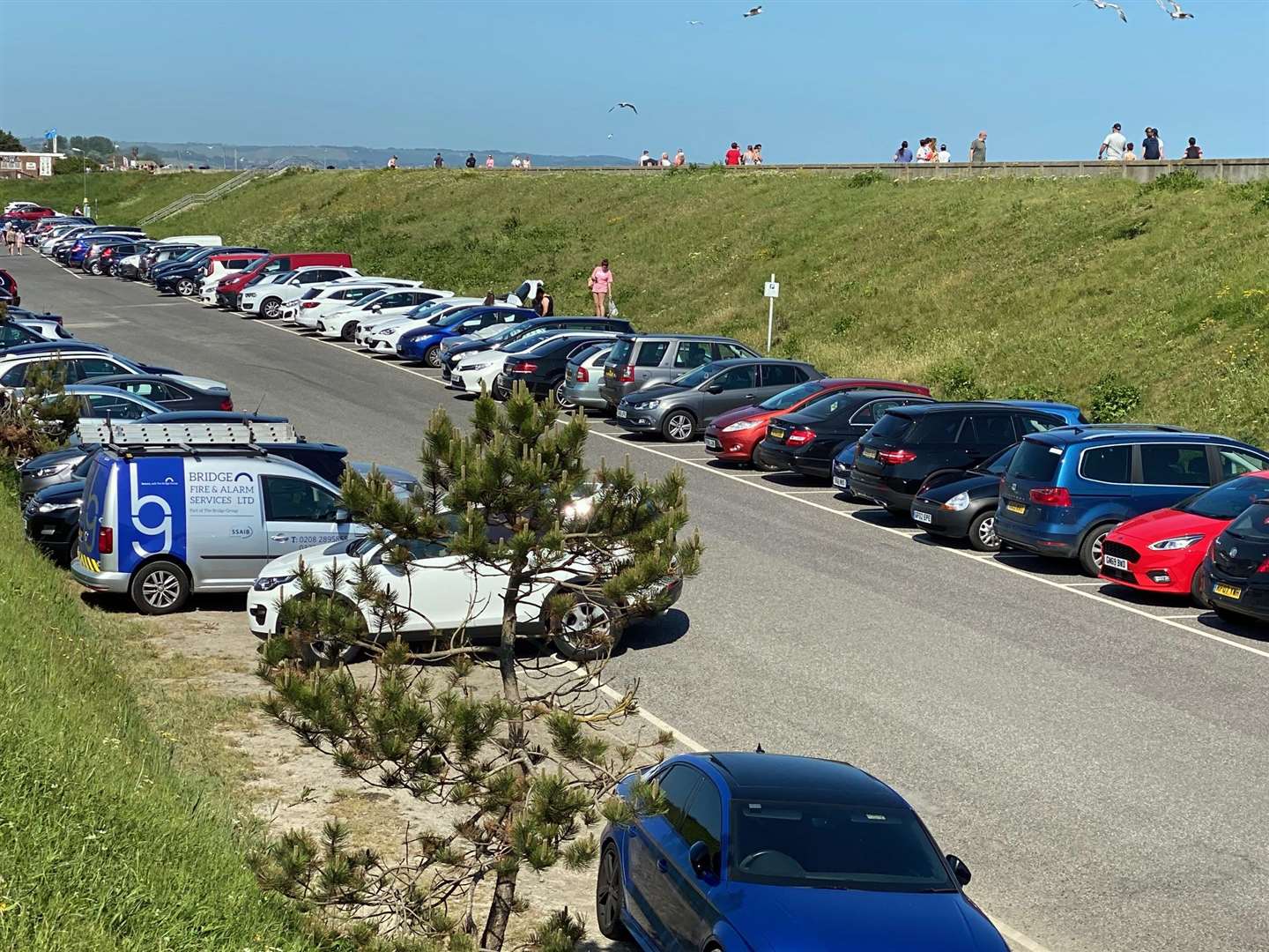 Firefighters fear an increase in beach visitors due to the sunny weather, as seen in Dymchurch last week, whose cars can clog up key roads