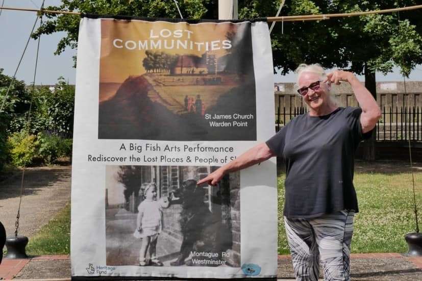 Daf Charman with a photo of her as a little girl coming face to face with a big dog in West Minster, as part of Big Fish Arts production of Lost Communities of Sheppey for the Whitstable Biennale