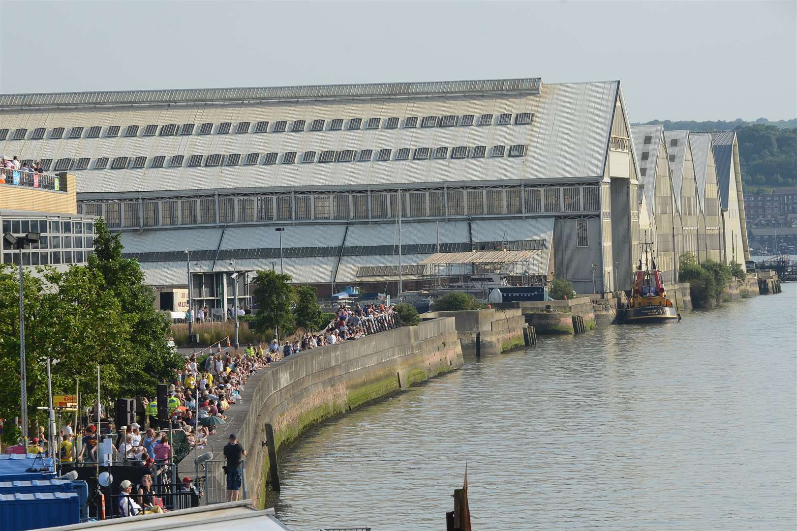 People lined the river wall.