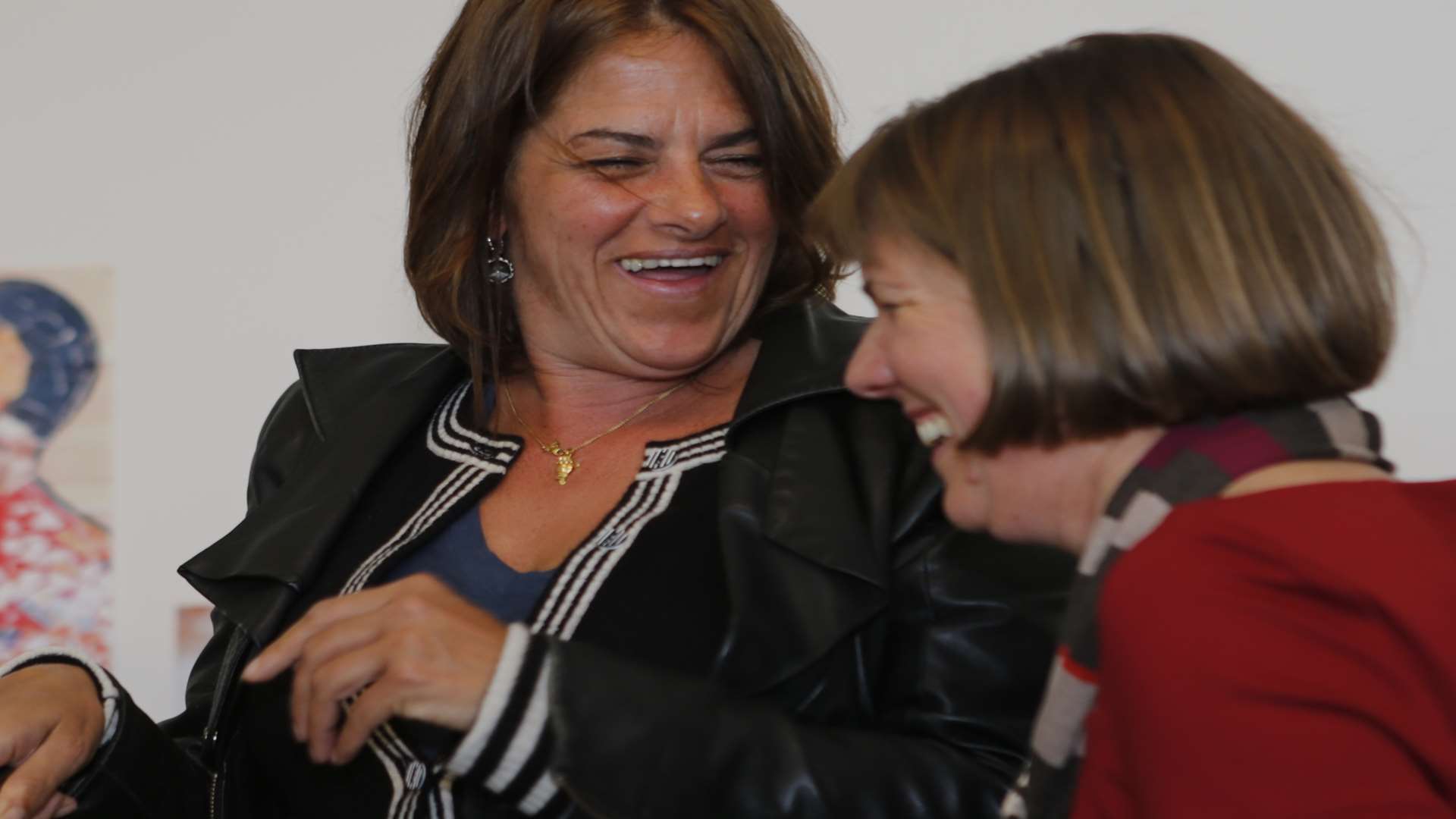 Tracey Emin cuts the cake as gallery director Victoria Pomery looks on.