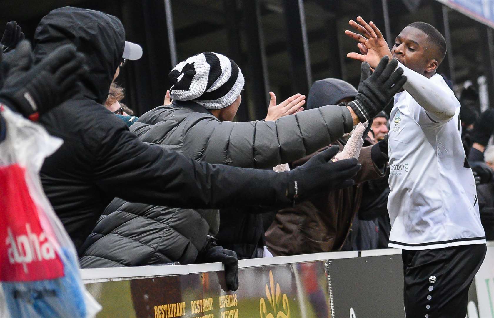 Dover's Shadrach Ogie celebrates with the fans on Saturday. Picture: Alan Langley FM27601742