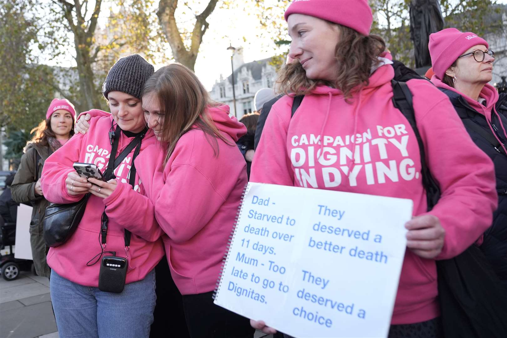 Supporters of Dignity in Dying celebrate on hearing the result of the vote on the Terminally Ill Adults (End of Life) Bill, outside the Houses of Parliament (Stefan Rousseau/PA)