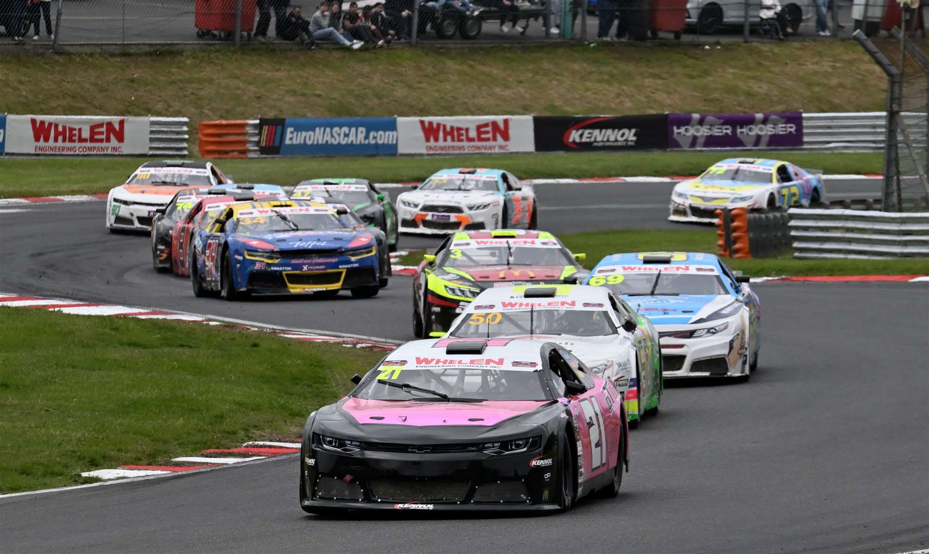 Davidson’s Chevrolet Camaro leads the pack through McLaren. He is now 15th in the EuroNASCAR Pro standings, and seventh in EuroNASCAR 2. Picture: Simon Hildrew