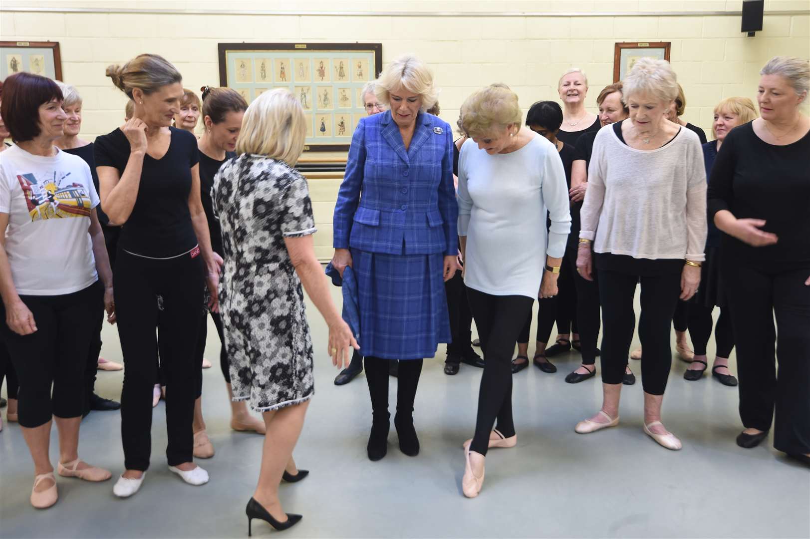 Camilla learning a step from Angela Rippon after watching a Silver Swans class at the Royal Academy of Dance in Battersea, London in 2018 (Eddie Mulholland/Daily Telegraph/PA)