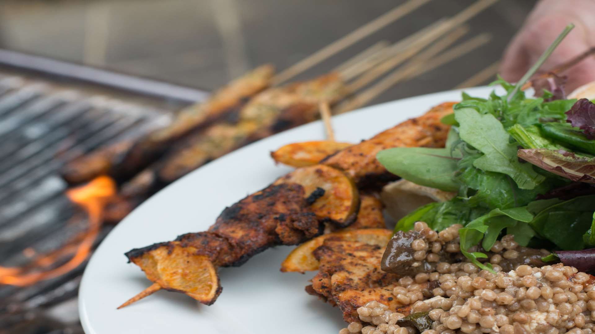 Jambalaya chargrilled barbecue chicken thighs with baby leaves and harissa mayo